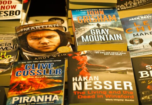 A collection of bestselling thriller novels prominently displayed in a bookstore setting.